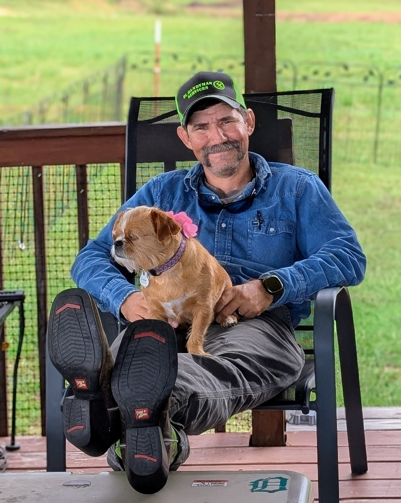Adam Lazenby, a 42-year-old man from Columbia, TN, smiling while holding his beloved dog. Adam needs a kidney transplant to survive.